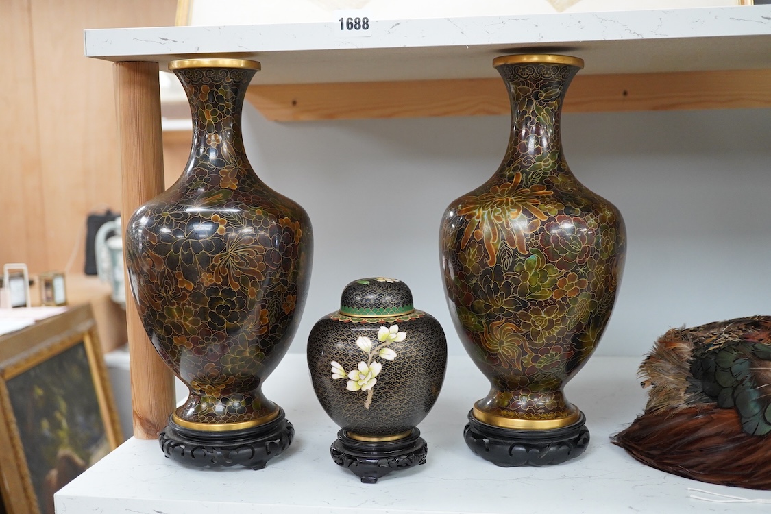 A pair of Chinese cloisonné enamel vases on stands and similar ginger jar, vases 34.6cm high including stands.